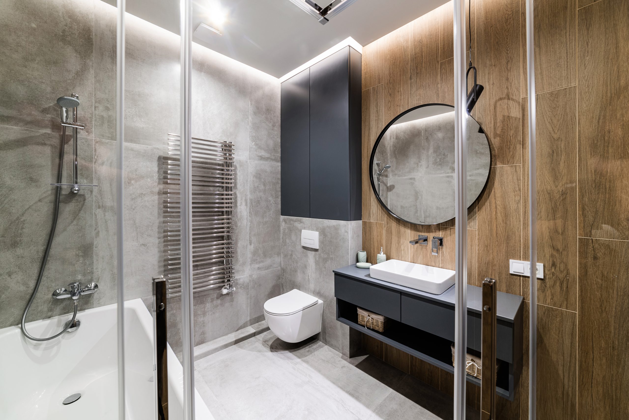 Interior design of the bathroom vimnat with gray tiles